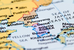 close up of a world map with the border between  North and South Korea in focus