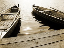 boat on the lake, sepia