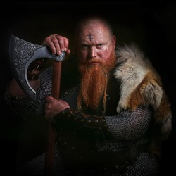 Portrait of viking holding axe