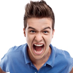 Angry young man looking straight forward and shouting