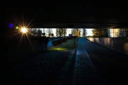 Low autumn sun shines in pedestrian underpass, Urban architecture photo, Shadow and light, No people, Vasteras, Sweden