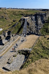 The Tintagel Bridge opened in 2019 connects the mainland with the island where the Arthurian Legend of Camelot was imagined. Tintagel castle, Cornwall, England, United Kingdom - 12th of August 2022