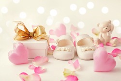 close-up of baby shoes and gift box