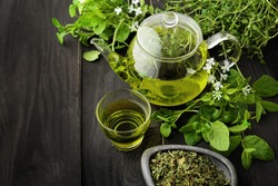 healthy green tea cup with tea leaves 