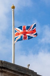 The Union flag flying at half-mast at Buckingham Palace in London, UK, to mark the death of Her Majesty Queen Elizabeth II.