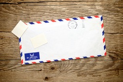 Old envelope on wooden background