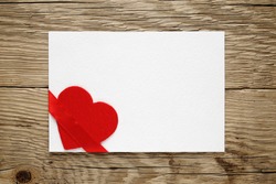 Valentine card with red heart and ribbon