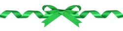 Green curled ribbon with bow. Long border isolated on a white background.