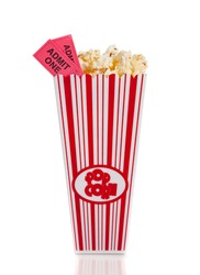 A container of movie popcorn with two tickets on a white background