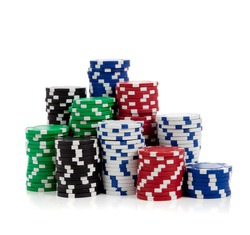 Stacks of poker chips including red, black, white, green and blue on a white background