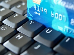Credit card on computer keyboard.