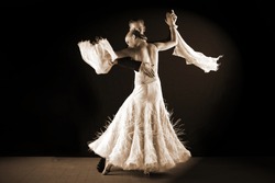 Latino dancers in ballroom isolated on black