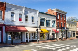 Traditional American Brick Buildings with Colourful Shops along a Brick Pavement
