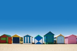Beautiful small bathing houses on white sandy beach at Brighton Beach, Australia