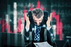 Double exposure of Stressed businessman feeling desperate on crisis stock market, investment concept.