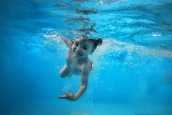 Beautiful underwater girl in the swimming pool