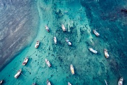 Aerial view of beautiful ocean seascape with fishing boats in the coast