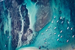 Aerial view of beautiful ocean seascape with fishing boats in the coast
