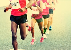 Marathon running race, people feet on city road 