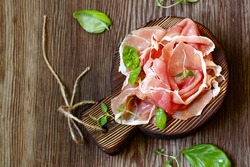 Parma italian dried ham on a wooden board