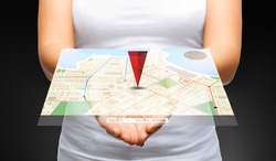 people, navigation, location and technology concept - close up of womans cupped hands showing 3d gps navigator map