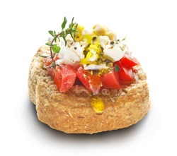 barley rusk called dakos ,topped with feta cheese, tomato cubes,olive oil and oregano ,typical Greek plate served with ouzo or raki