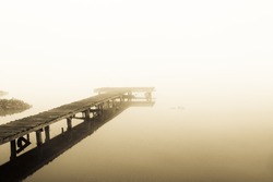 old jetty walkway pier at the lake in morning