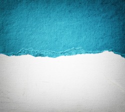 old canvas texture background with delicate stripes pattern and blue vintage torn paper