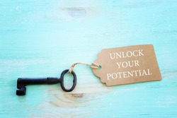 unlock your potential concept. vintage key with tag