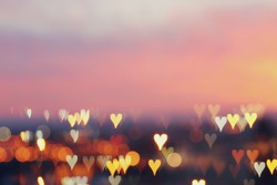 Valentine's day romantic glitter bokeh background with many hearts lights