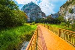 Mountain Snake Stone Park, or Khao Ngu Stone Park, limestone mountain hill and lake with walkway bridge, tourist attraction in Ratchaburi province, Thailand