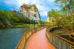 Mountain Snake Stone Park, or Khao Ngu Stone Park, limestone mountain hill and lake with walkway bridge, tourist attraction in Ratchaburi province, Thailand