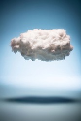 One cloud on a blue background. Weather and digital cloud concept. Cotton handmade.