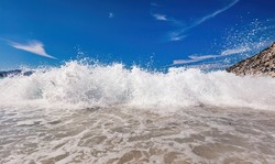 Waves crashing Ionian sea in Greece. Myrtos beach in Kefalonia