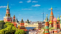 Panoramic view of the Red Square with Moscow Kremlin and St Basil's Cathedral in summer, Moscow, Russia. It is a main tourist destination in Moscow. Beautiful scenery of the heart of sunny Moscow.