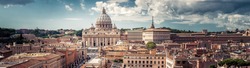 Panoramic view of Rome with St Peter's Basilica in Vatican City, Italy. Beautiful Roma skyline. Nice panorama of Rome from above. Rome cityscape with landmark in summer. Horizontal banner with Rome.