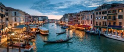 Panorama of Venice at night, Italy. Beautiful cityscape of Venice in evening. Panoramic view of Grand Canal at dusk. It is one of main tourist attractions of Venice. Urban landscape of Venice city.
