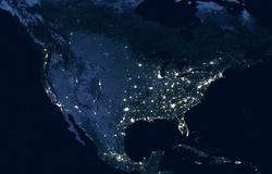 Earth at night, view of city lights showing human activity in USA from space. North America on world dark map on global satellite photo. Elements of this image furnished by NASA.