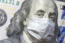 COVID-19 affects stock market, 100 US dollar money bill with face mask. World economy hit by coronavirus outbreak. Concept of crash, pandemic, business, global recession, corona and monkey pox virus.