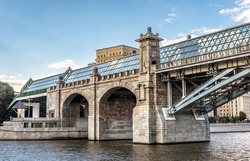 Pushkinsky foot bridge across Moskva River, Moscow, Russia. Scenery of footbridge in Moscow city center. Pedestrian bridge, historical landmark of Moscow in summer. Old architecture of Moscow.