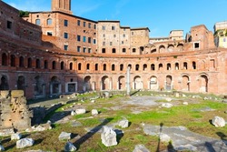 Forum and Market of Trajan, Rome, Italy. Famous old Trajan’s buildings is famous tourist attractions of Rome. Panorama of Ancient Roman ruins in Rome city center. Landmark, travel and history concept.