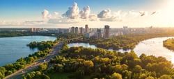 Panorama of Moscow at sunset, Russia. Nice landscape, scenery of city park and Strogino district in Moscow northwest. Aerial panoramic view of Moskva River bays. Scenic Moscow skyline in summer. 