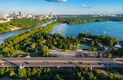 Moscow view, Russia. Aerial scenic view of Moskva River, bay and park in Schukino district. Scenery of Stroginsky Bridge road, nice landscape of Moscow northwest. Moscow skyline in summer. 