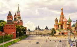 Kremlin and St Basil's Cathedral on the Red Square in Moscow in summer, Russia. Moscow Kremlin is one of the main travel attractions in Europe. Beautiful sunny panorama of Moscow centre. UNESCO site.