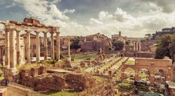 Roman Empire ruins, Rome, Italy. Scenery of Roman Forum or Foro Romano, panorama of Ancient ruins in Roma city center. Vintage style photo, remains of past civilization view, Temple of Saturn in left
