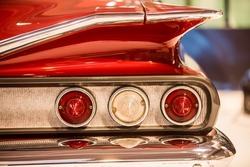 Close up image of the rear lights of a vintage car.