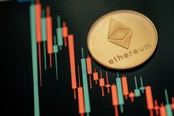 Gold Ethereum cryptocurrency with candle stick graph chart and digital background.