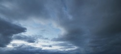 Dark ornamental clouds. Dramatic sky. Epic storm cloudscape. Panoramic image, texture, background, graphic resources, design, copy space. Meteorology, weather, thunderstorm. hurricane concepts