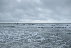 Baltic sea after the storm. Dramatic glowing clouds. Seascape, cloudscape, gale, nature. Panoramic view. Ecology, climate change, weather