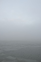Baltic sea in a fog. Waves, splashing water, storm. Natural textures. Picturesque panoramic monochrome scenery, seascape. Nature, environment, rough weather, danger